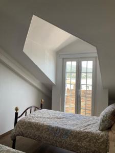Tempat tidur dalam kamar di Casa da Nazaré