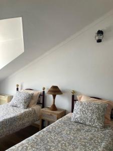 Tempat tidur dalam kamar di Casa da Nazaré