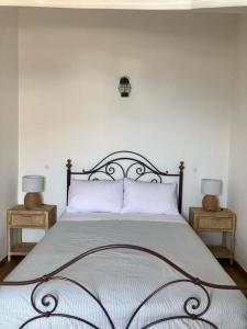 Tempat tidur dalam kamar di Casa da Nazaré
