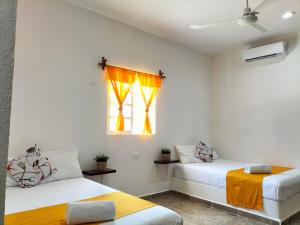 Postel nebo postele na pokoji v ubytování HOTEL LAS COLORADAS