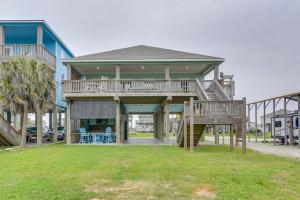 a large house with a deck and a staircase at Modern Crystal Beach Escape, Walk to Beach! in Crystal Beach