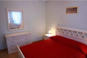 A bed or beds in a room at Villa delle Rose