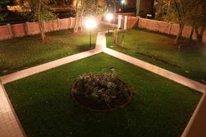 A garden outside Villa delle Rose