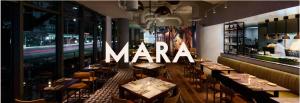 a restaurant with tables and a sign that reads mara at Renaissance Honolulu Hotel & Spa in Honolulu