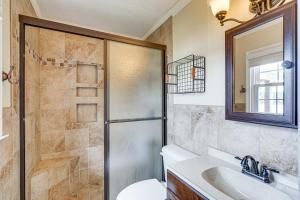 a bathroom with a shower and a toilet and a sink at Waterfront Lake Gaston Home with Private Dock! in Littleton +35 photos