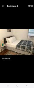 a picture of a bed in a room at LOVELY RENOVATED 2 BEDROOM HOME WITH FREE Parking in Albany