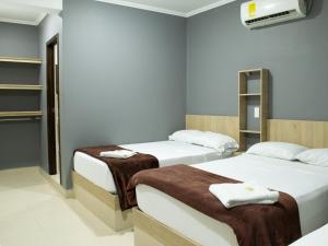 Voodi või voodid majutusasutuse Hotel Ruiseñor Itagui toas