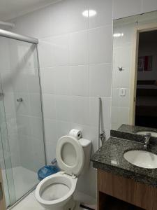 a bathroom with a shower and a toilet and a sink at Lacqua Diroma Parque in Caldas Novas