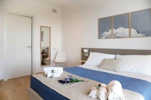 Postel nebo postele na pokoji v ubytování Le Nereidi Green Resort Elisa