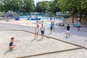 a group of people playing in a playground at The Beach Mobile Home in Saint-Brevin-les-Pins