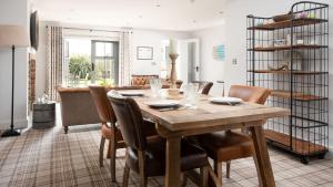 a dining room with a wooden table and chairs at Number Nine in Lanchester