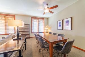 a dining room with a table and chairs and a ceiling fan at #535- Village, Walk to Gondola, Restaurants, and Shops in Mammoth Lakes