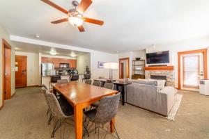a dining room and living room with a ceiling fan at #535- Village, Walk to Gondola, Restaurants, and Shops in Mammoth Lakes