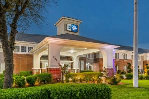 a building with a gazebo in front of it at Best Western Fort Worth Inn and Suites in Fort Worth