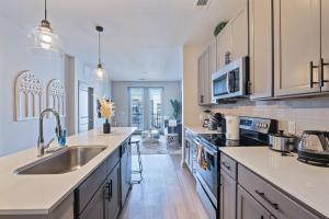 a kitchen with a sink and a counter top at Stylish 1 Bed in Downtown St Pete W Free Parking in St Petersburg