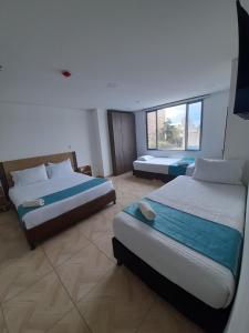 Postel nebo postele na pokoji v ubytování Hotel Royal Cid Bogota + 12 fotografií