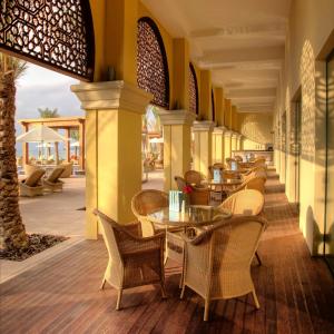 a row of tables and chairs on a patio at Djibouti Palace Kempinski in Djibouti