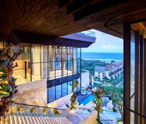a view of the ocean from the balcony of a house at The Apurva Kempinski Bali in Nusa Dua