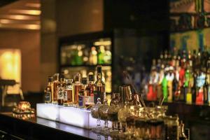 a bar with a lot of bottles of alcohol at Kempinski Hotel Chengdu-City Center in Chengdu