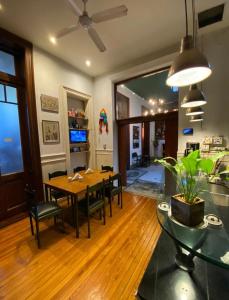 a dining room with a table and chairs at LGY Bed & Breakfast ONLY MEN-SOLO HOMBRES in Buenos Aires