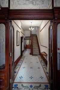 a hallway with a staircase with a tile floor at No4 Garlands Apartment in Saint Annes on the Sea