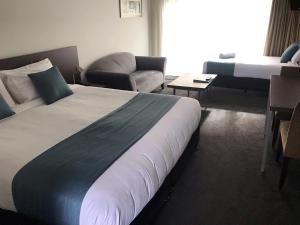 Postel nebo postele na pokoji v ubytování Airport Delta Motel