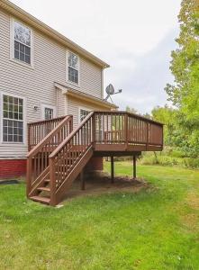 a wooden deck in front of a house at Condo Townhome - Cleveland Lake Area 