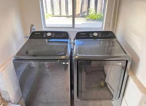 two ovens sitting next to a window in a kitchen at Spacious Downtown Home SJ in San Jose