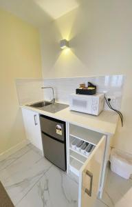 Kuchyň nebo kuchyňský kout v ubytování Grand Central Serviced Apartments