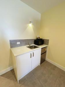 Kuchyň nebo kuchyňský kout v ubytování Grand Central Serviced Apartments