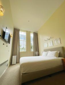 Postel nebo postele na pokoji v ubytování Grand Central Serviced Apartments