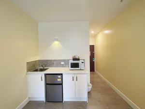 Kuchyň nebo kuchyňský kout v ubytování Grand Central Serviced Apartments