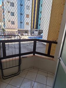 a room with a balcony with a view of a building at Apartamento Millenium Thermas Residence 103 - B in Caldas Novas