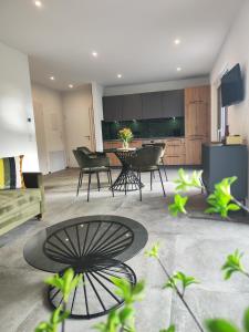 a living room with a table and chairs at Ferienwohnung Ott in Bad Endorf