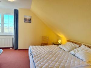 En eller flere senge i et værelse på Neddesitz - Fewo - 30 - Block