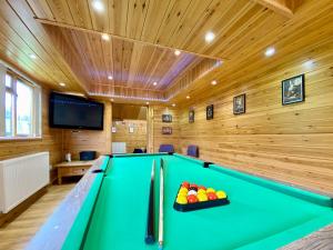 a billiard room with a green pool table at Apple-uk46285 in Camerton