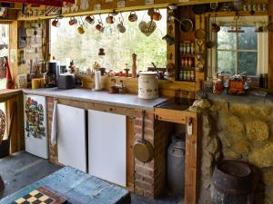 a kitchen with a counter and a counter top at Bramley Cottage in Langley