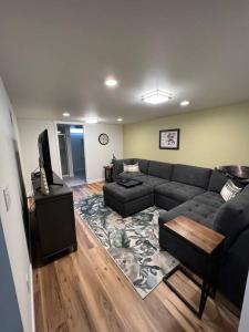 a living room with a couch and a table at The Badger House ~ Newly Remodeled Home ~ Rib Mountain in Wausau