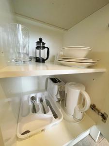 Kuchyň nebo kuchyňský kout v ubytování Grand Central Serviced Apartments
