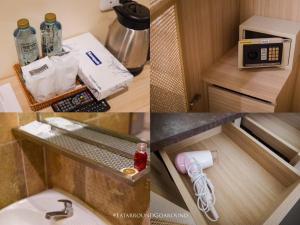 a small bathroom with a sink and a microwave at The Way Patong Hotel in Patong Beach