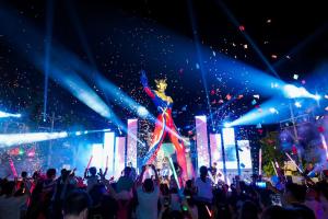 a woman standing on a stage in front of a crowd at Shanghai Haichang Ocean Park Resort Hotel in Shanghai