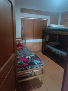 a room with two bunk beds in a room at Finca con Piscina Privada/Jacuzzi/Asador in San Vicente +11 photos