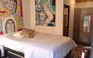 Postel nebo postele na pokoji v ubytování Hotel Gran Boutique Sabana