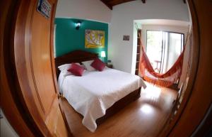 Postel nebo postele na pokoji v ubytování Hotel Gran Boutique Sabana