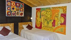 Postel nebo postele na pokoji v ubytování Hotel Gran Boutique Sabana