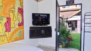 TV a/nebo společenská místnost v ubytování Hotel Gran Boutique Sabana