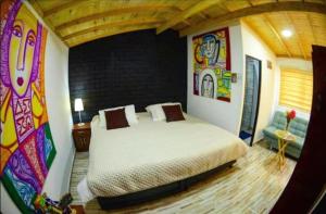 Postel nebo postele na pokoji v ubytování Hotel Gran Boutique Sabana