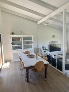 a dining room with a table and chairs at Life's A Beach in Manyana