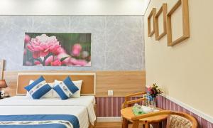 Postel nebo postele na pokoji v ubytování Sao Vang Hotel