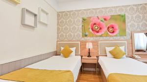 Postel nebo postele na pokoji v ubytování Sao Vang Hotel